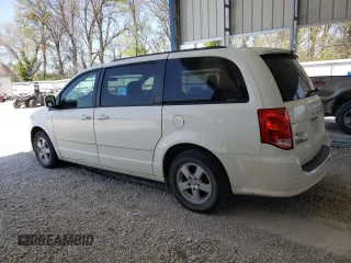 2013 Dodge Grand Caravan SXT with VIN 2C4RDGCG5DR554126, listed as a Copart auction lot 52160805 with 201,161 mi miles and Salvage Title. Bid and sale history available at DreamBid. Image 2.