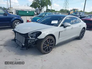 2018 Porsche Panamera 4 E-Hybrid z VIN WP0AE2A7XJL174378, wystawiony jako IAAI lot #42303125 z przebiegiem 35 636 mil mil oraz . Historia ofert i sprzedaży dostępna na DreamBid. Obrazek 2.