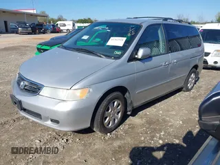 2004 Honda Odyssey EX-L with VIN 5FNRL18974B057715, listed as a IAAI auction lot 41762518 with 193,626 mi miles and . Bid and sale history available at DreamBid. Image 2.
