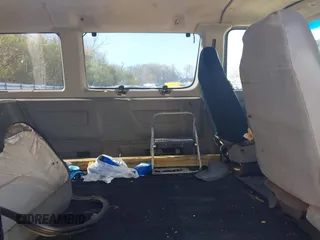 2005 Ford Econoline Passenger XL with VIN 1FBNE31L55HB00500, listed as a IAAI auction lot 42144394 with 257,262 mi miles. Bid and sale history available at carsss.com. Image 8.