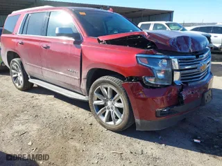 2016 Chevrolet Tahoe LTZ with VIN 1GNSKCKC9GR205745, listed as a IAAI auction lot 41710241 with 94,931 mi miles. Bid and sale history available at carsss.com. Image 1.