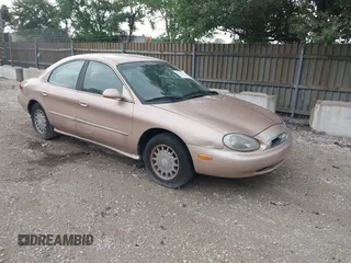1996 Mercury Sable LS z VIN 1MELM53S1TG638988, wystawiony jako IAAI lot #42523616 z przebiegiem 87 087 mil mil oraz . Historia ofert i sprzedaży dostępna na DreamBid. Obrazek 1.