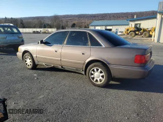 1995 Audi A6 z VIN WAUGA84A2SN055887, wystawiony jako Copart lot #85212394 z przebiegiem 254 307 mil mil oraz Tytuł czysty. Historia ofert i sprzedaży dostępna na DreamBid. Obrazek 2.