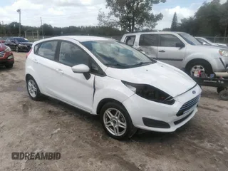 2019 Ford Fiesta SE z VIN 3FADP4EJ7KM159044, wystawiony jako IAAI lot #39699812 z przebiegiem 55 915 mil mil oraz . Historia ofert i sprzedaży dostępna na DreamBid. Obrazek 1.