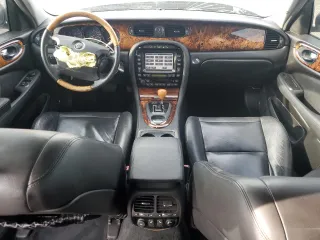 2004 Jaguar XJ with VIN SAJEA71C54SG01455, listed as a Copart auction lot 86591014 with 83,977 mi miles and Salvage Title. Bid and sale history available at carsss.com. Image 8.