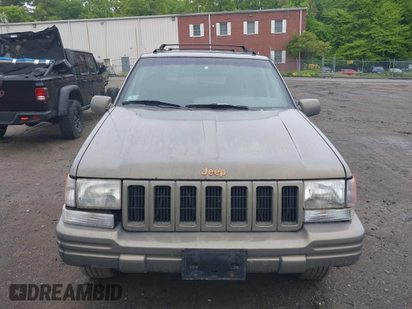 1998 Jeep Grand Cherokee Limited z VIN 1J4GZ78Y5WC261391, wystawiony jako IAAI lot #42275913 z przebiegiem 180 552 mil mil oraz . Historia ofert i sprzedaży dostępna na DreamBid. Obrazek 6.