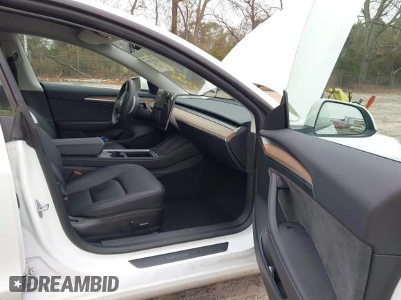 2023 Tesla Model 3 Long Range with VIN 5YJ3E1EB9PF393622, listed as a IAAI auction lot 41207132 with 14,097 mi miles and . Bid and sale history available at DreamBid. Image 5.