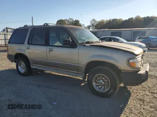 1999 Ford Explorer XL with VIN 1FMZU34X2XUA28059, listed as a Copart auction lot 77668294 with 131,064 mi miles and Salvage title. Bid and sale history available at DreamBid. Image 4.