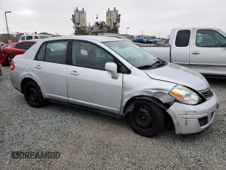 2011 Nissan Versa S with VIN 3N1BC1AP9BL458761, listed as a Copart auction lot 57317115 with 122,606 mi miles and Salvage title. Bid and sale history available at DreamBid. Image 4.