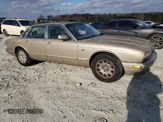 1998 Jaguar XJ with VIN SAJHX1242WC845736, listed as a Copart auction lot 82006044 with 188,785 mi miles and Salvage title. Bid and sale history available at DreamBid. Image 4.