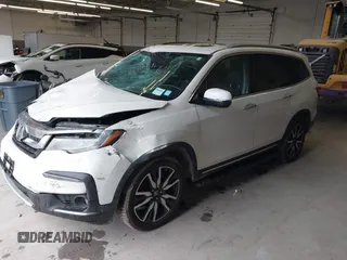 2019 Honda Pilot Elite with VIN 5FNYF6H08KB054725, listed as a IAAI auction lot 40496860 with 91,284 mi miles and . Bid and sale history available at DreamBid. Image 2.