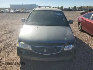 1999 Honda Odyssey EX with VIN 2HKRL1860XH541737, listed as a Copart auction lot 88897965 with 112,164 mi miles and Salvage title. Bid and sale history available at DreamBid. Image 5.