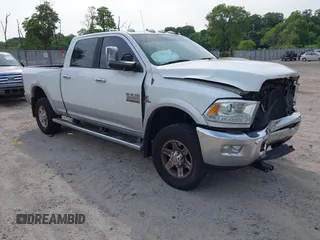 2013 Ram 2500 Laramie z VIN 3C6UR5FL9DG617556, wystawiony jako IAAI lot #42403465 z przebiegiem 210 030 mil mil oraz . Historia ofert i sprzedaży dostępna na DreamBid. Obrazek 1.