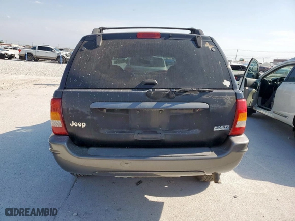 2004 Jeep Grand Cherokee Laredo with VIN 1J4GX48S24C303786, listed as a Copart auction lot 53482155 with 167,823 mi miles and Salvage Title. Bid and sale history available at carsss.com. Image 6.