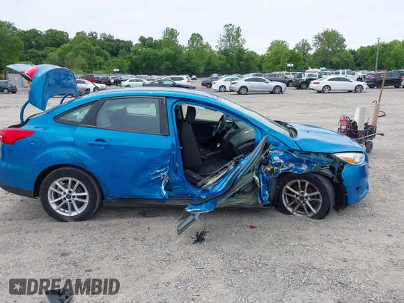 2015 Ford Focus SE z VIN 1FADP3F26FL252212, wystawiony jako IAAI lot #42345763 z przebiegiem 102 549 mil mil oraz . Historia ofert i sprzedaży dostępna na DreamBid. Obrazek 13.