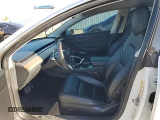 2020 Tesla Model 3 Standard Range Plus with VIN 5YJ3E1EA5LF660417, listed as a Copart auction lot 48144125 with 112,924 mi miles and Salvage Title. Bid and sale history available at DreamBid. Image 7.
