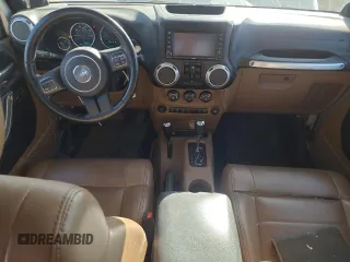 2012 Jeep Wrangler Unlimited Call of Duty MW3 с VIN 1C4BJWFG3CL103865, выставлен на аукционе Copart как лот 74237754 с пробегом 104 232 миль миль и Списание • Salvage title. История ставок и продаж доступна на DreamBid. Изображение 8.