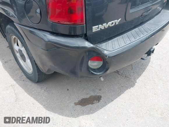 2005 GMC Envoy SLE with VIN 1GKDS13SX52373187, listed as a IAAI auction lot 42434190 with 112,965 mi miles and . Bid and sale history available at DreamBid. Image 12.