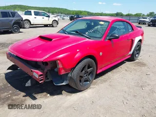 2004 Ford Mustang GT Deluxe z VIN 1FAFP42XX4F210024, wystawiony jako IAAI lot #42119586 z przebiegiem 176 164 mil mil oraz . Historia ofert i sprzedaży dostępna na DreamBid. Obrazek 2.