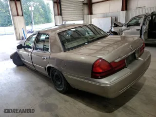 2003 Mercury Grand Marquis GS Convenience with VIN 2MEFM74W43X706057, listed as a Copart auction lot 65842884 with 215,829 mi miles and Salvage Title. Bid and sale history available at carsss.com. Image 2.