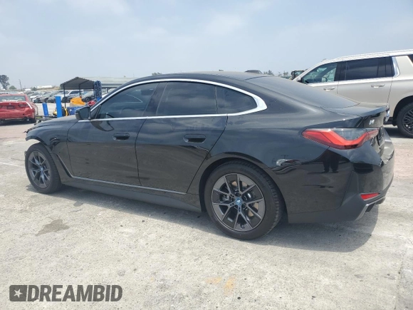 2024 BMW i4 eDrive35 with VIN WBY43AW02RFT03098, listed as a Copart auction lot 57317884 with 203 mi miles and Salvage Title. Bid and sale history available at carsss.com. Image 2.
