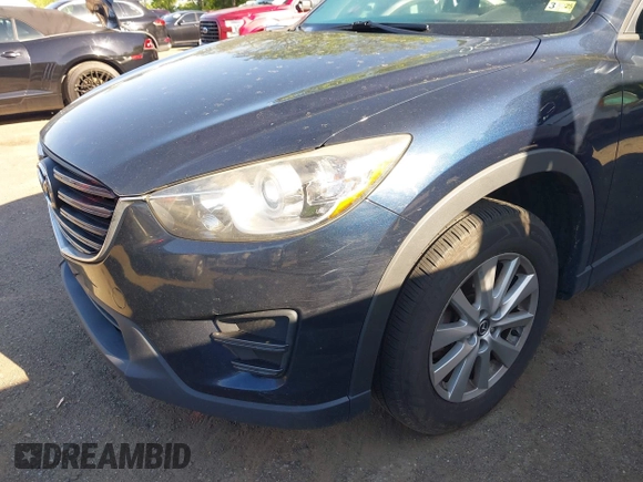 2016 Mazda CX-5 Sport with VIN JM3KE2BY3G0657904, listed as a IAAI auction lot 42127897 with 153,855 mi miles. Bid and sale history available at carsss.com. Image 6.