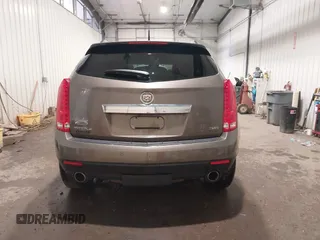 2014 Cadillac SRX Performance Collection z VIN 3GYFNFE38ES578066, wystawiony jako IAAI lot #42153023 z przebiegiem 134 009 mil mil oraz . Historia ofert i sprzedaży dostępna na DreamBid. Obrazek 17.