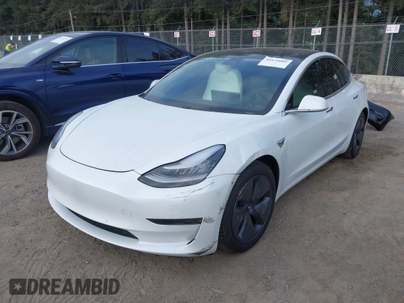 2020 Tesla Model 3 Standard Range Plus with VIN 5YJ3E1EA5LF613002, listed as a IAAI auction lot 42129085 with 55,672 mi miles. Bid and sale history available at carsss.com. Image 20.