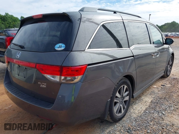 2015 Honda Odyssey Touring Elite z VIN 5FNRL5H97FB060981, wystawiony jako IAAI lot #42289631 z przebiegiem 160 947 mil mil oraz . Historia ofert i sprzedaży dostępna na DreamBid. Obrazek 4.