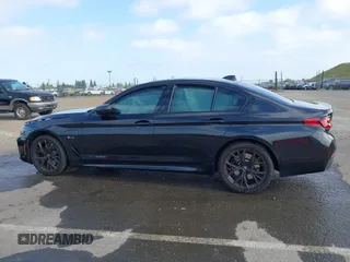 2023 BMW 5 Series 530e with VIN WBA13AG09PCL56556, listed as a IAAI auction lot 42098427 with Not provided miles and . Bid and sale history available at DreamBid. Image 14.