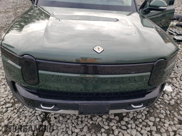 2024 Rivian R1T Adventure z VIN 7FCTGCAA1RN030829, wystawiony jako Copart lot #81459854 z przebiegiem Nie podano mil oraz Szkody całkowita. Historia ofert i sprzedaży dostępna na DreamBid. Obrazek 13.