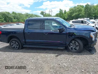 2023 Ford F-150 Lightning Pro с VIN 1FT6W1EVXPWG42428, выставлен на аукционе IAAI как лот 39711091 с пробегом 6 308 миль миль и . История ставок и продаж доступна на DreamBid. Изображение 13.