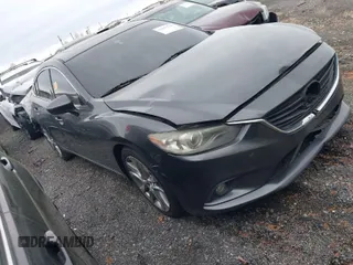 2014 Mazda 6 i Grand Touring with VIN JM1GJ1W50E1107877, listed as a IAAI auction lot 41857596 with 166,188 mi miles. Bid and sale history available at carsss.com. Image 1.