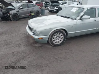 1998 Jaguar XJ with VIN SAJHN1242WC819689, listed as a IAAI auction lot 41148530 with 60,143 mi miles and . Bid and sale history available at DreamBid. Image 6.
