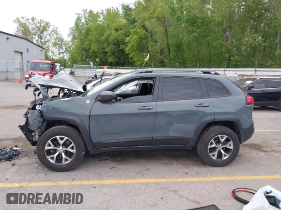 2015 Jeep Cherokee Trailhawk z VIN 1C4PJMBB9FW676566, wystawiony jako IAAI lot #42303335 z przebiegiem 123 026 mil mil oraz . Historia ofert i sprzedaży dostępna na DreamBid. Obrazek 14.
