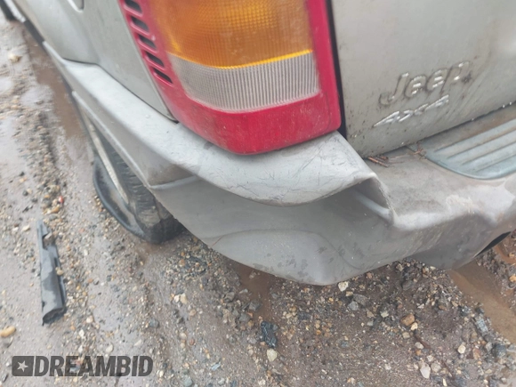 2003 Jeep Grand Cherokee Laredo z VIN 1J4GW48S33C599693, wystawiony jako IAAI lot #42228885 z przebiegiem 257 551 mil mil oraz . Historia ofert i sprzedaży dostępna na DreamBid. Obrazek 6.
