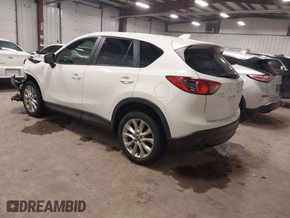 2014 Mazda CX-5 Grand Touring with VIN JM3KE4DY3E0374036, listed as a IAAI auction lot 41889030 with 162,611 mi miles and . Bid and sale history available at DreamBid. Image 3.