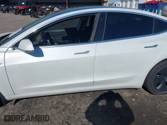 2020 Tesla Model 3 Standard Range Plus with VIN 5YJ3E1EA7LF797150, listed as a IAAI auction lot 41869088 with 75,708 mi miles and . Bid and sale history available at carsss.com. Image 14.