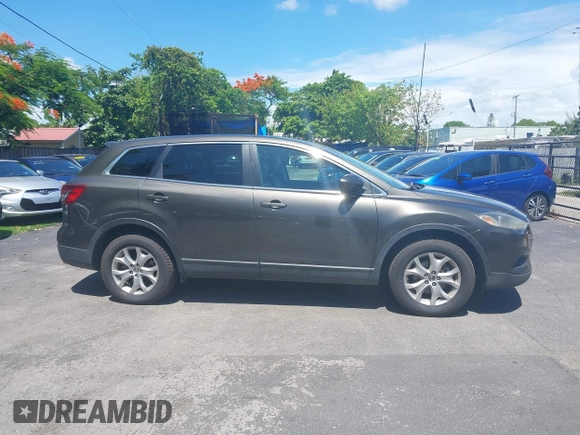 2015 Mazda CX-9 Touring z VIN JM3TB2CV1F0458995, wystawiony jako IAAI lot #42523344 z przebiegiem 130 763 mil mil oraz . Historia ofert i sprzedaży dostępna na DreamBid. Obrazek 13.