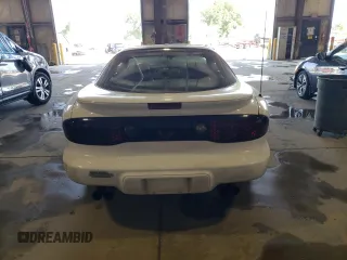 2001 Pontiac Firebird Formula z VIN 2G2FV22G212134322, wystawiony jako Copart lot #70813194 z przebiegiem Nie podano mil oraz Szkody całkowita. Historia ofert i sprzedaży dostępna na DreamBid. Obrazek 6.
