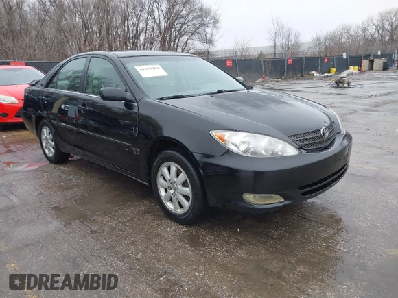 2004 Toyota Camry LE with VIN 4T1BF32K84U074364, listed as a IAAI auction lot 41479264 with 265,865 mi miles. Bid and sale history available at carsss.com. Image 1.