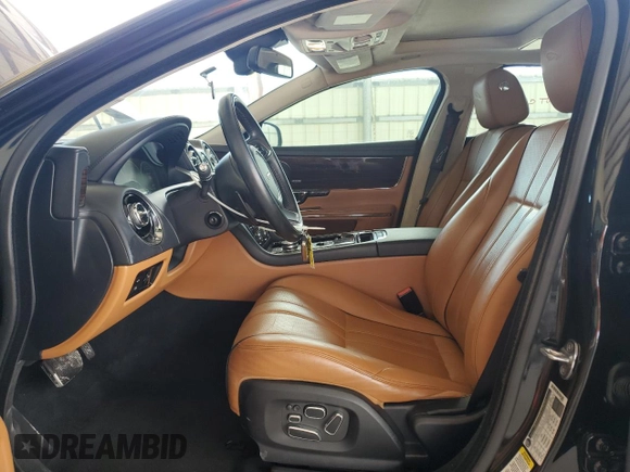 2014 Jaguar XJ Portfolio z VIN SAJWA2GZ4E8V60864, wystawiony jako Copart lot #76478674 z przebiegiem 50 578 mil mil oraz Szkoda całkowita • Salvage title. Historia ofert i sprzedaży dostępna na DreamBid. Obrazek 7.