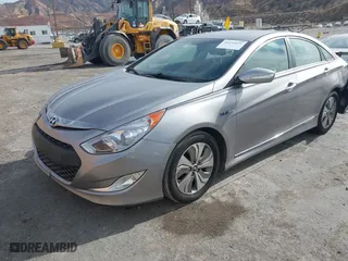 2013 Hyundai Sonata Hybrid with VIN KMHEC4A42DA089524, listed as a IAAI auction lot 41233221 with 114,636 mi miles. Bid and sale history available at carsss.com. Image 2.