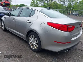 2014 Kia Optima EX z VIN 5XXGN4A70EG335090, wystawiony jako IAAI lot #42272655 z przebiegiem 165 795 mil mil oraz . Historia ofert i sprzedaży dostępna na DreamBid. Obrazek 3.