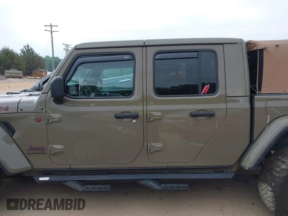 2020 Jeep Gladiator Rubicon z VIN 1C6JJTBG6LL179541, wystawiony jako IAAI lot #42050510 z przebiegiem 52 784 mil mil oraz . Historia ofert i sprzedaży dostępna na DreamBid. Obrazek 13.