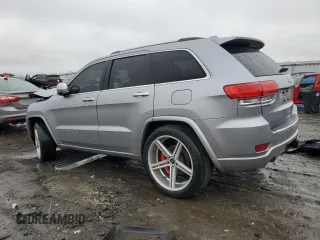 2014 Jeep Grand Cherokee Overland with VIN 1C4RJECG9EC341865, listed as a Copart auction lot 44354615 with 141,601 mi miles and Salvage Title. Bid and sale history available at carsss.com. Image 2.