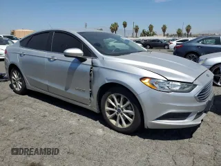 2017 Ford Fusion Hybrid SE z VIN 3FA6P0LU9HR306927, wystawiony jako Copart lot #63943395 z przebiegiem 157 851 mil mil oraz Czysty tytuł • Clean title. Historia ofert i sprzedaży dostępna na DreamBid. Obrazek 4.
