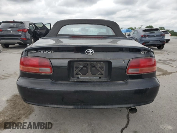 1996 Toyota Celica GT z VIN JT5FG02T3T0031613, wystawiony jako Copart lot #58410225 z przebiegiem 124 899 mil mil oraz Szkoda całkowita • Salvage title. Historia ofert i sprzedaży dostępna na DreamBid. Obrazek 6.