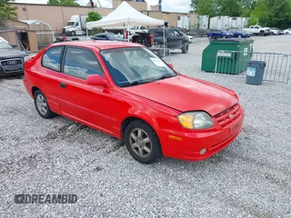 2003 Hyundai Accent GL z VIN KMHCG35CX3U247788, wystawiony jako IAAI lot #42254692 z przebiegiem 89 560 mil mil oraz . Historia ofert i sprzedaży dostępna na DreamBid. Obrazek 1.