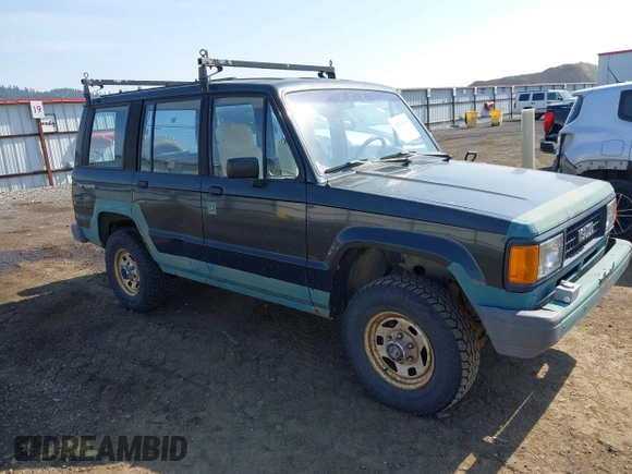 1990 Isuzu Trooper z VIN JACCH58EXL7903060, wystawiony jako IAAI lot #42516100 z przebiegiem 189 700 mil mil oraz . Historia ofert i sprzedaży dostępna na DreamBid. Obrazek 1.